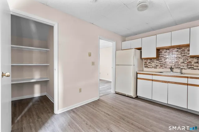 a bathroom with a shower a toilet and a shower