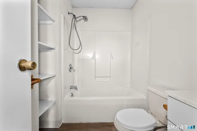 a view of room with window and hardwood floor