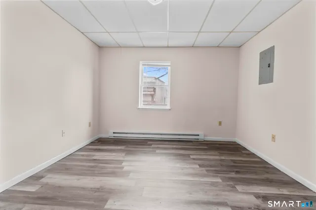 a view of hallway with wooden floor