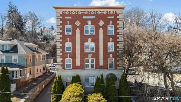 a picture of a building with a garden