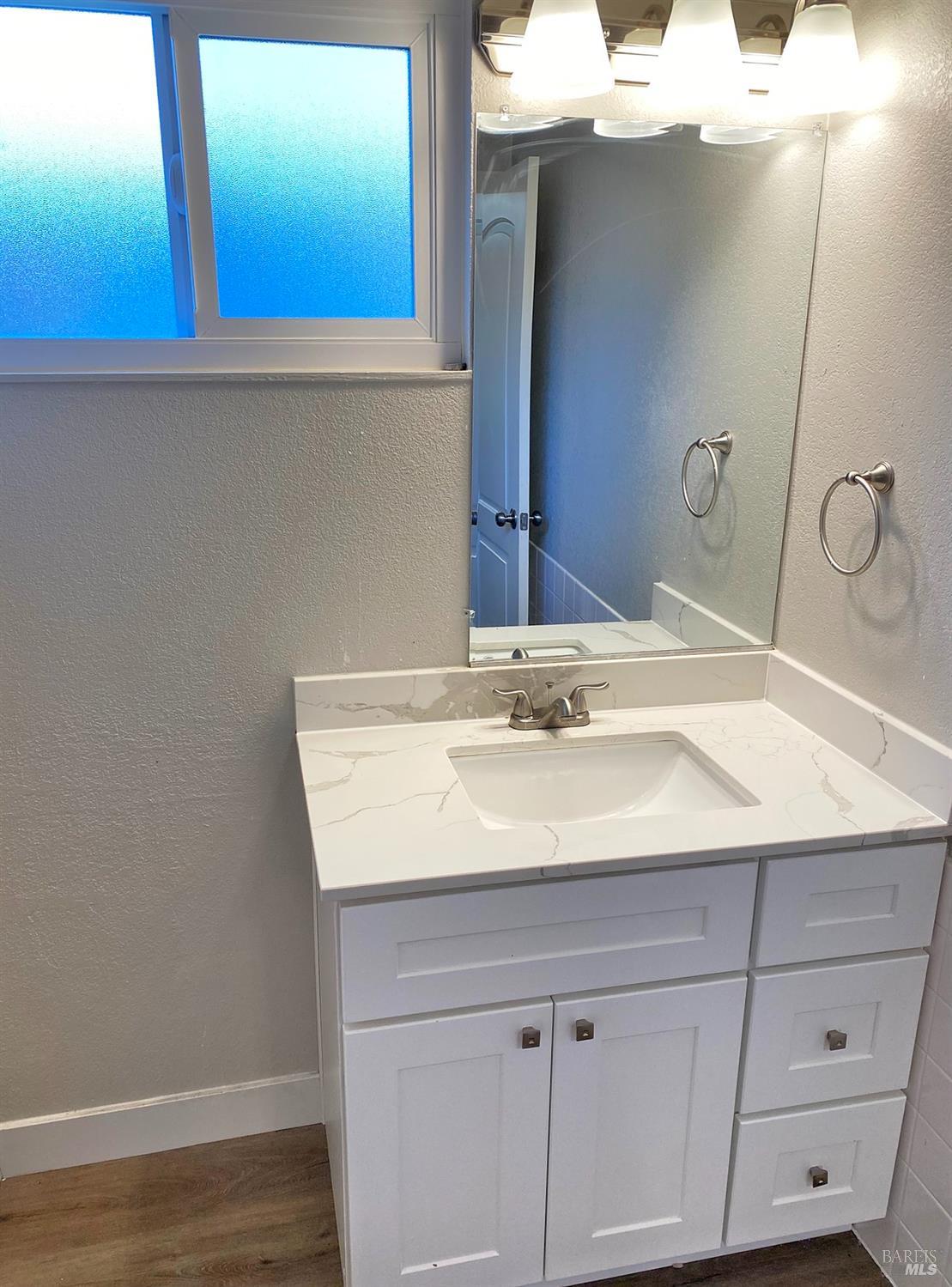 849 Finch Way Fairfield, CA 94533 - Photo 11 of 26 a bathroom with a sink and a mirror