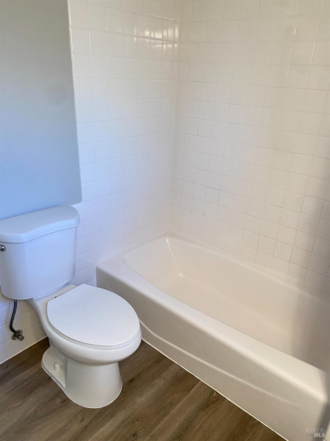 849 Finch Way Fairfield, CA 94533 - Photo 12 of 26 a white toilet sitting next to a bath tub