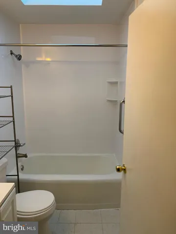 a bathroom with a shower and a toilet