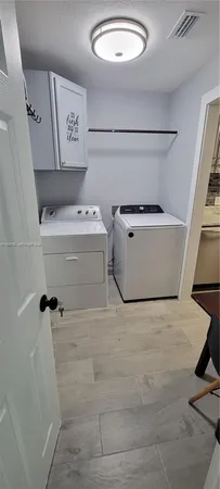 a kitchen with stainless steel appliances a stove a microwave and a refrigerator