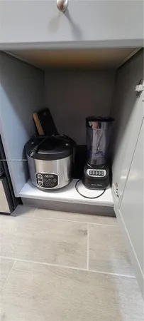 a kitchen with a sink cabinets and window