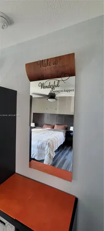 a view of a room with wooden floor