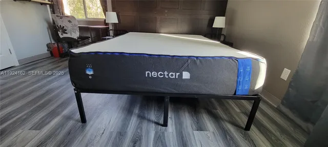 a view of living room with furniture and flat screen tv