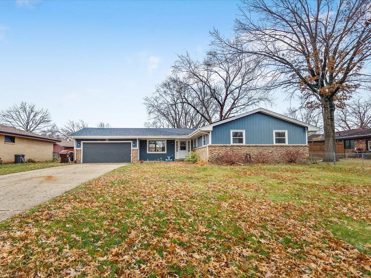 4821 Danforth Drive Rockford, IL 61114 - Photo 19 of 28 a view of a yard in front of a house with large trees