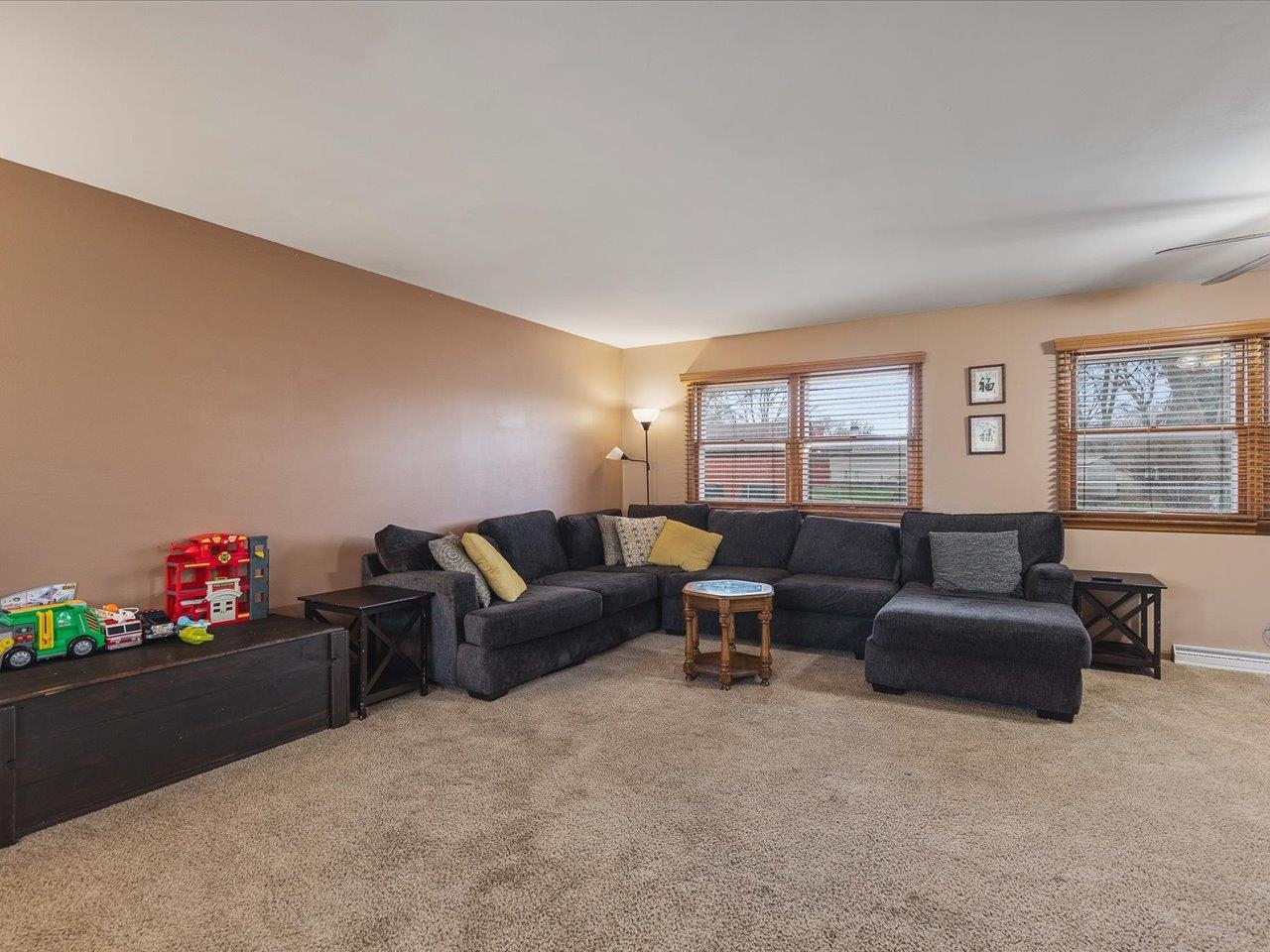 4821 Danforth Drive Rockford, IL 61114 - Photo 23 of 28 a living room with furniture window and wooden floor