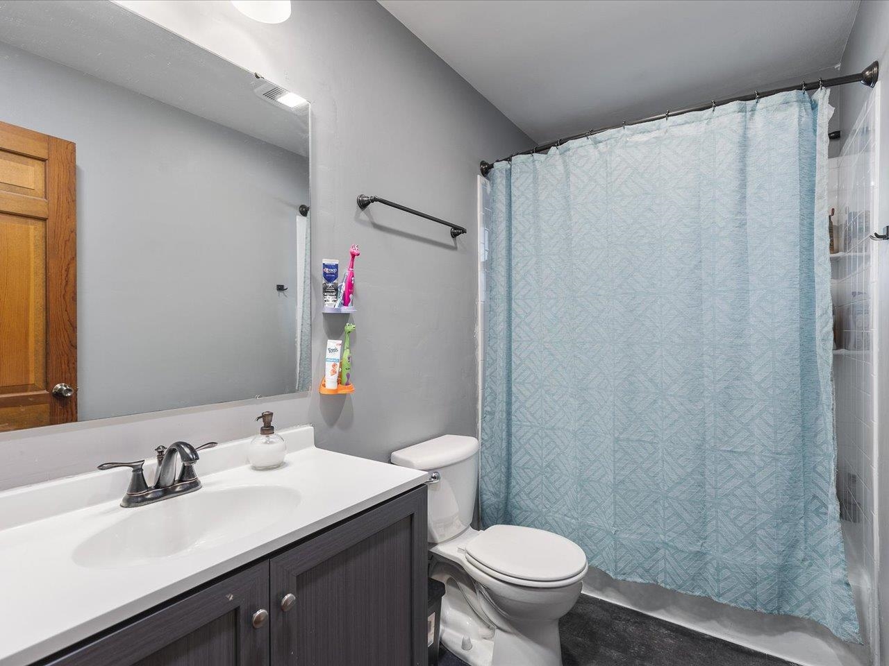 4821 Danforth Drive Rockford, IL 61114 - Photo 7 of 28 a bathroom with a sink toilet and shower