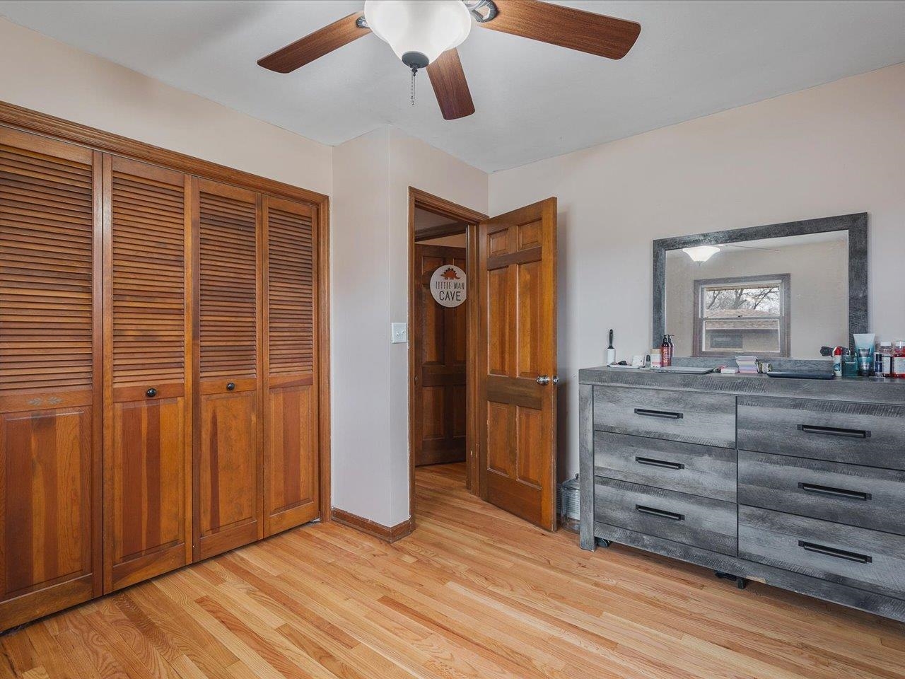 4821 Danforth Drive Rockford, IL 61114 - Photo 9 of 28 an empty room with wooden floor cabinet and windows