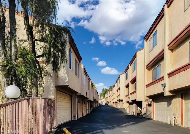 a view of an buildings from a balcony