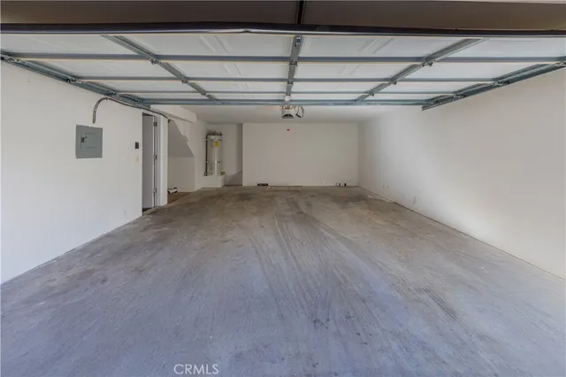 a view of a room with wooden floors