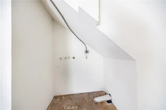 a view of staircase with white walls
