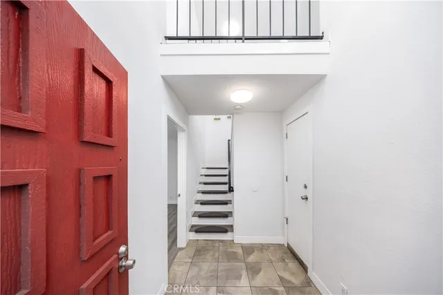 a view of a hallway with stairs and ventilation