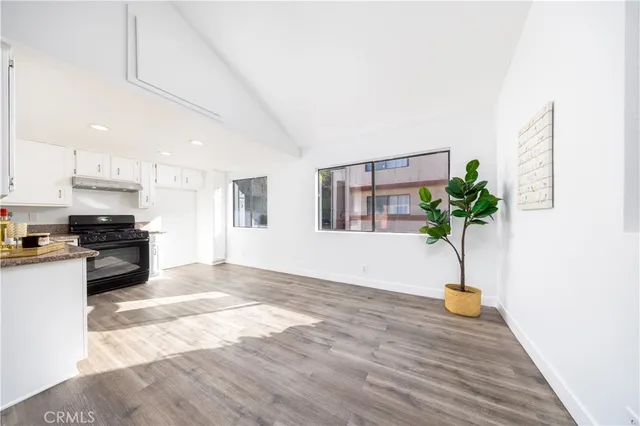 a view of kitchen with sink and natural light