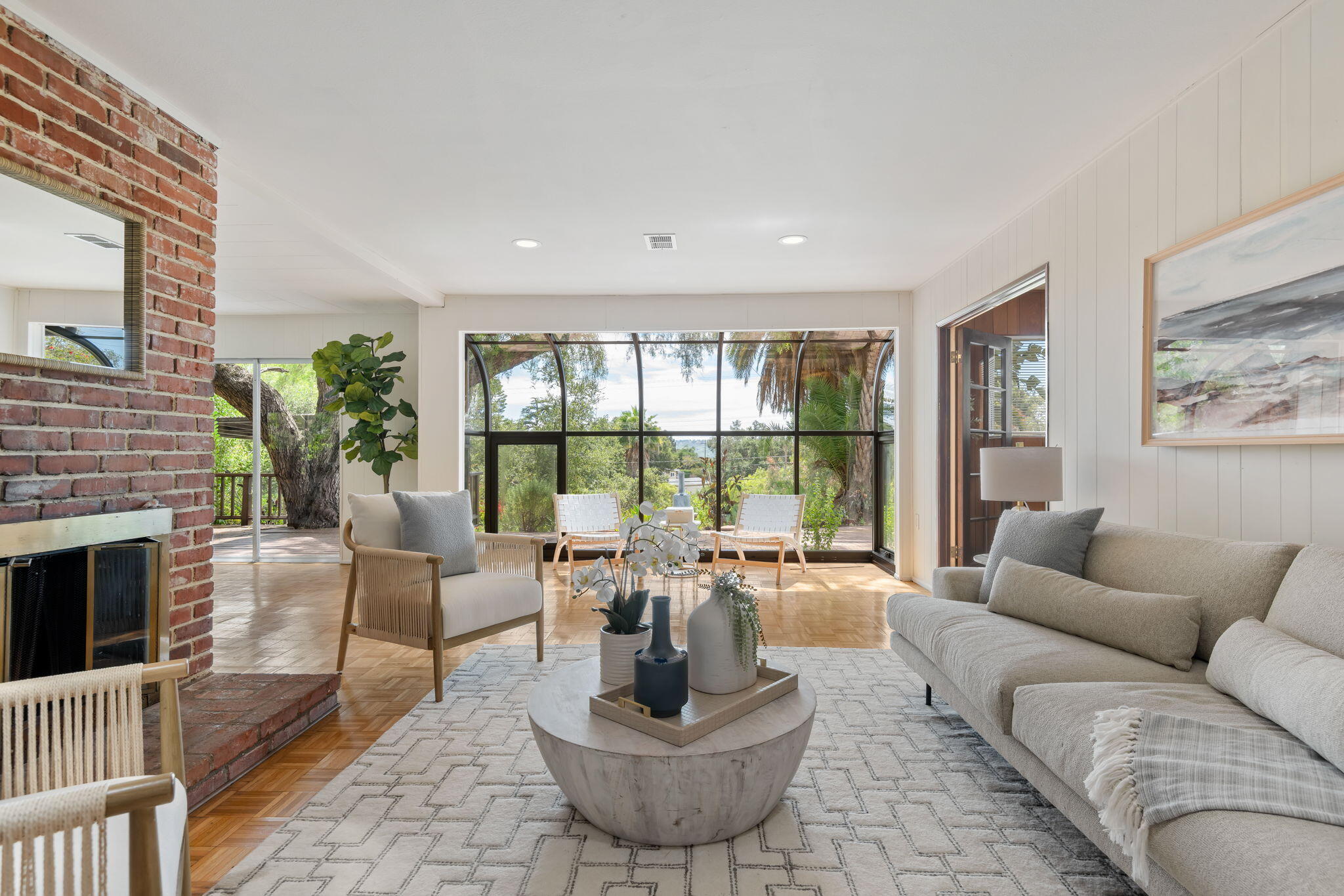 3855 Foothill Road Santa Barbara, CA 93110 - Photo 16 of 39 a living room with furniture large window and a fireplace