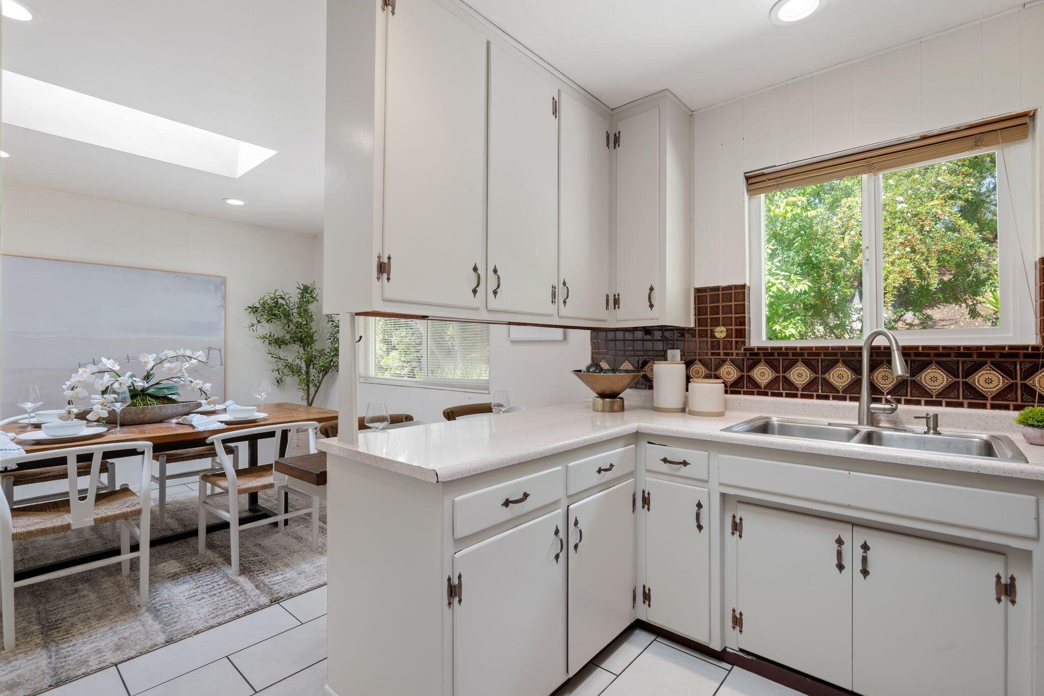 3855 Foothill Road Santa Barbara, CA 93110 - Photo 22 of 39 a kitchen with a sink window and cabinets