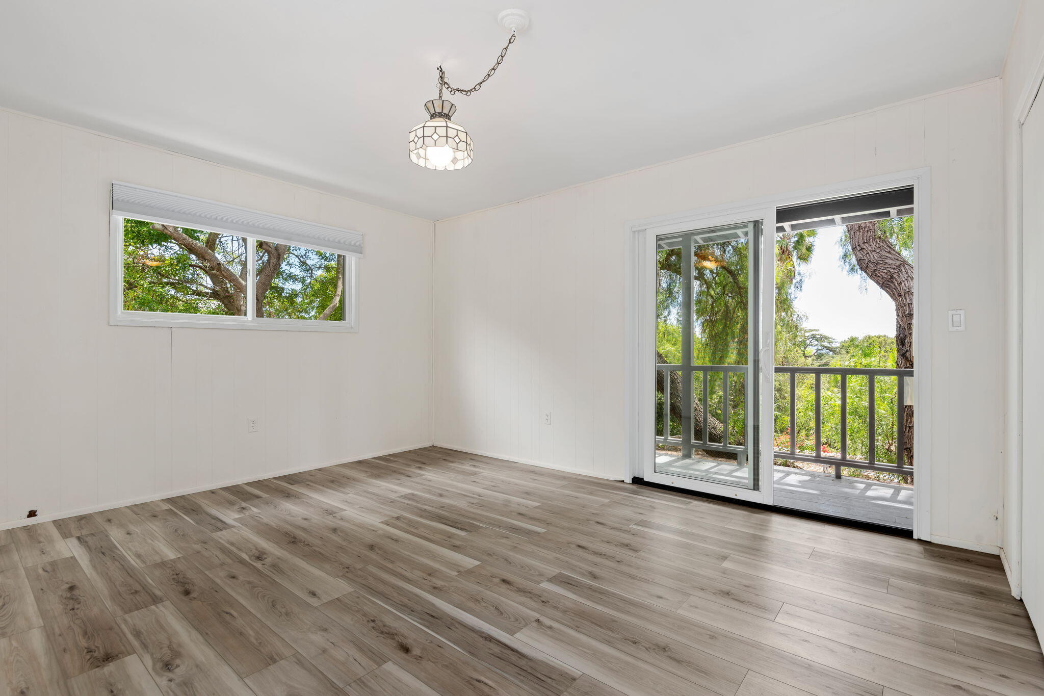 3855 Foothill Road Santa Barbara, CA 93110 - Photo 26 of 39 a view of an empty room with wooden floor and a window