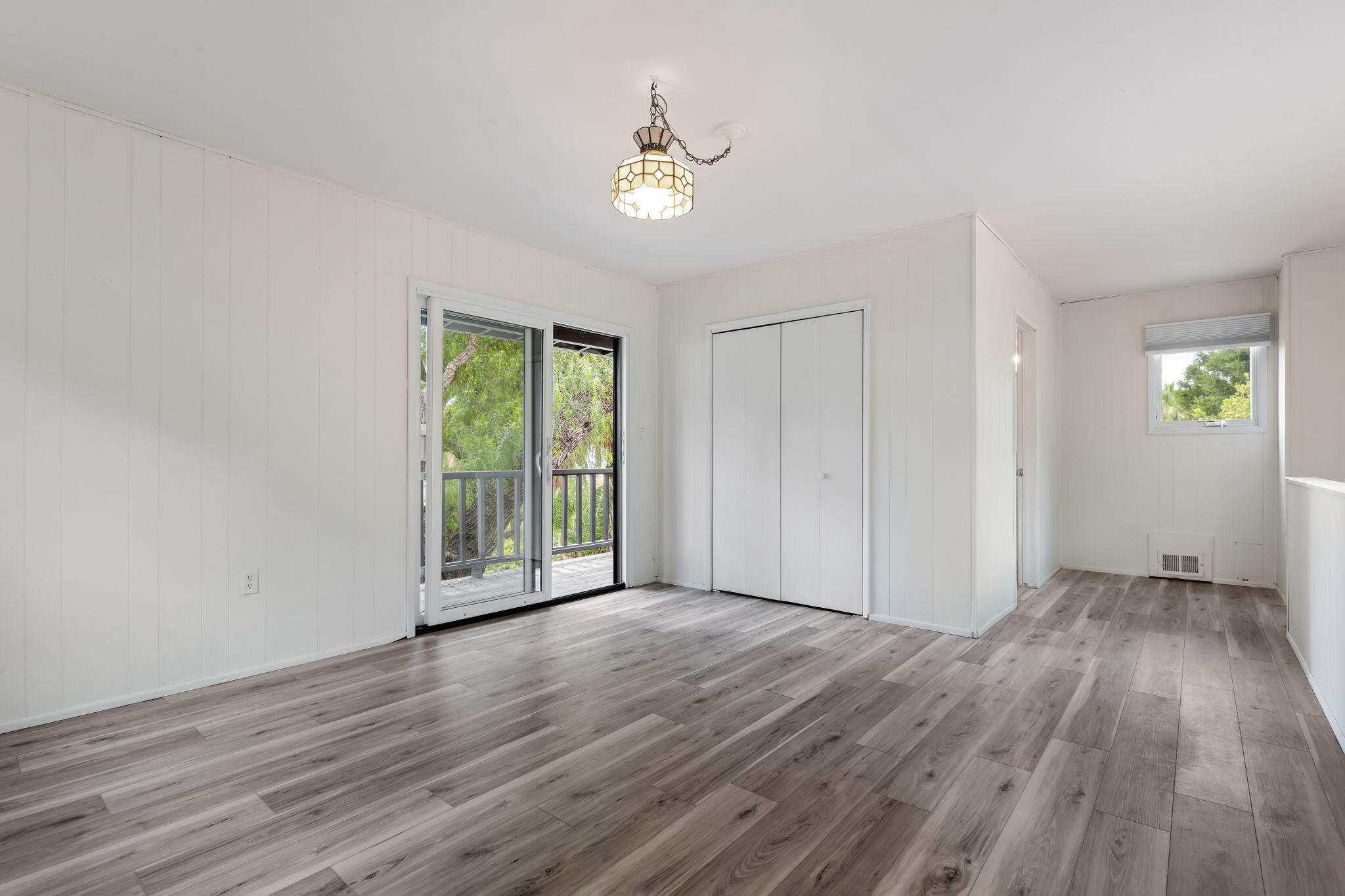 3855 Foothill Road Santa Barbara, CA 93110 - Photo 27 of 39 a view of an empty room with wooden floor and a window