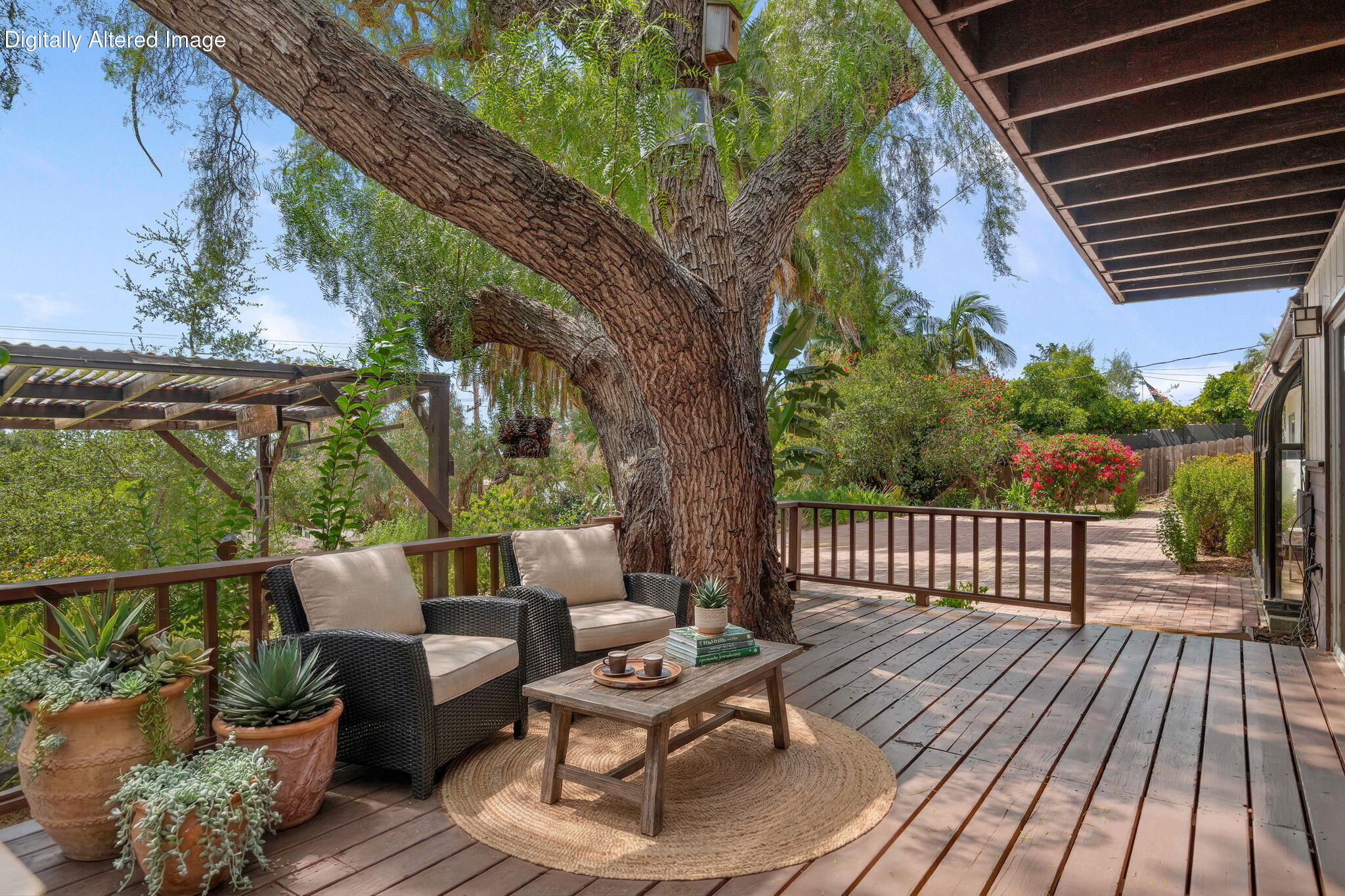 3855 Foothill Road Santa Barbara, CA 93110 - Photo 4 of 39 a balcony with wooden floor table and chairs