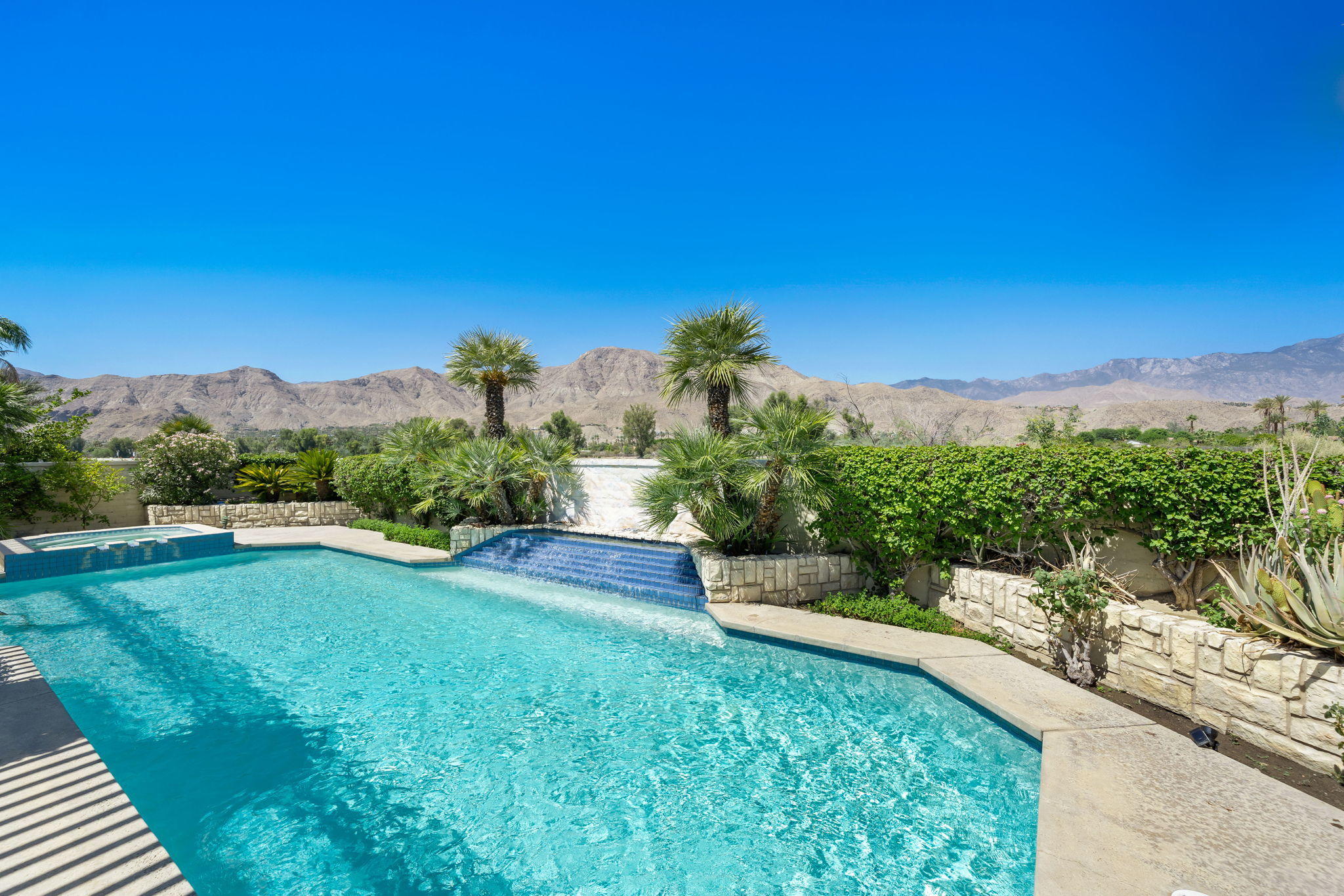 74 Mayfair Drive Rancho Mirage, CA 92270 - Photo 2 of 35 a view of a backyard with a garden