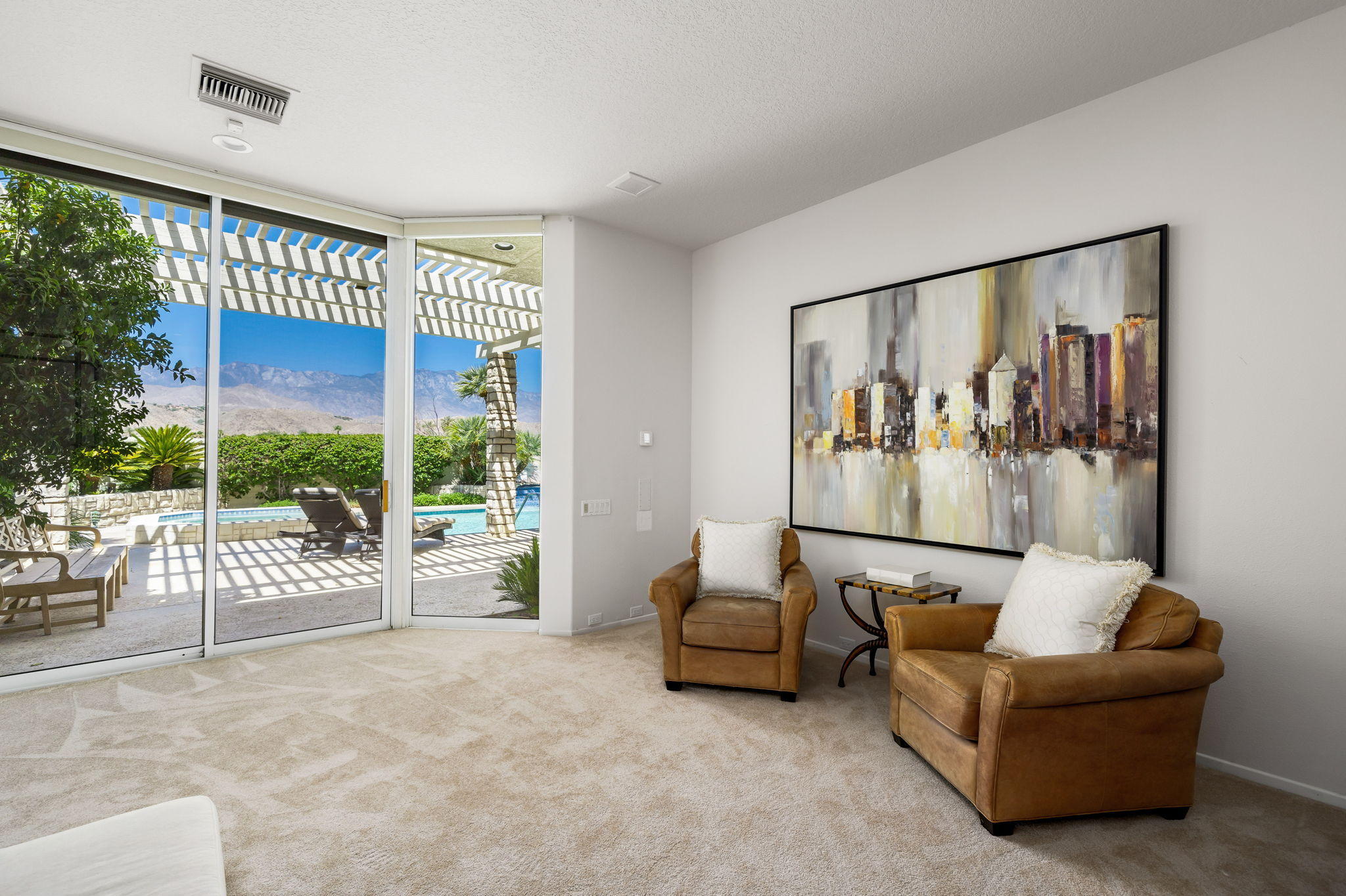 74 Mayfair Drive Rancho Mirage, CA 92270 - Photo 16 of 35 a living room with furniture and a large window
