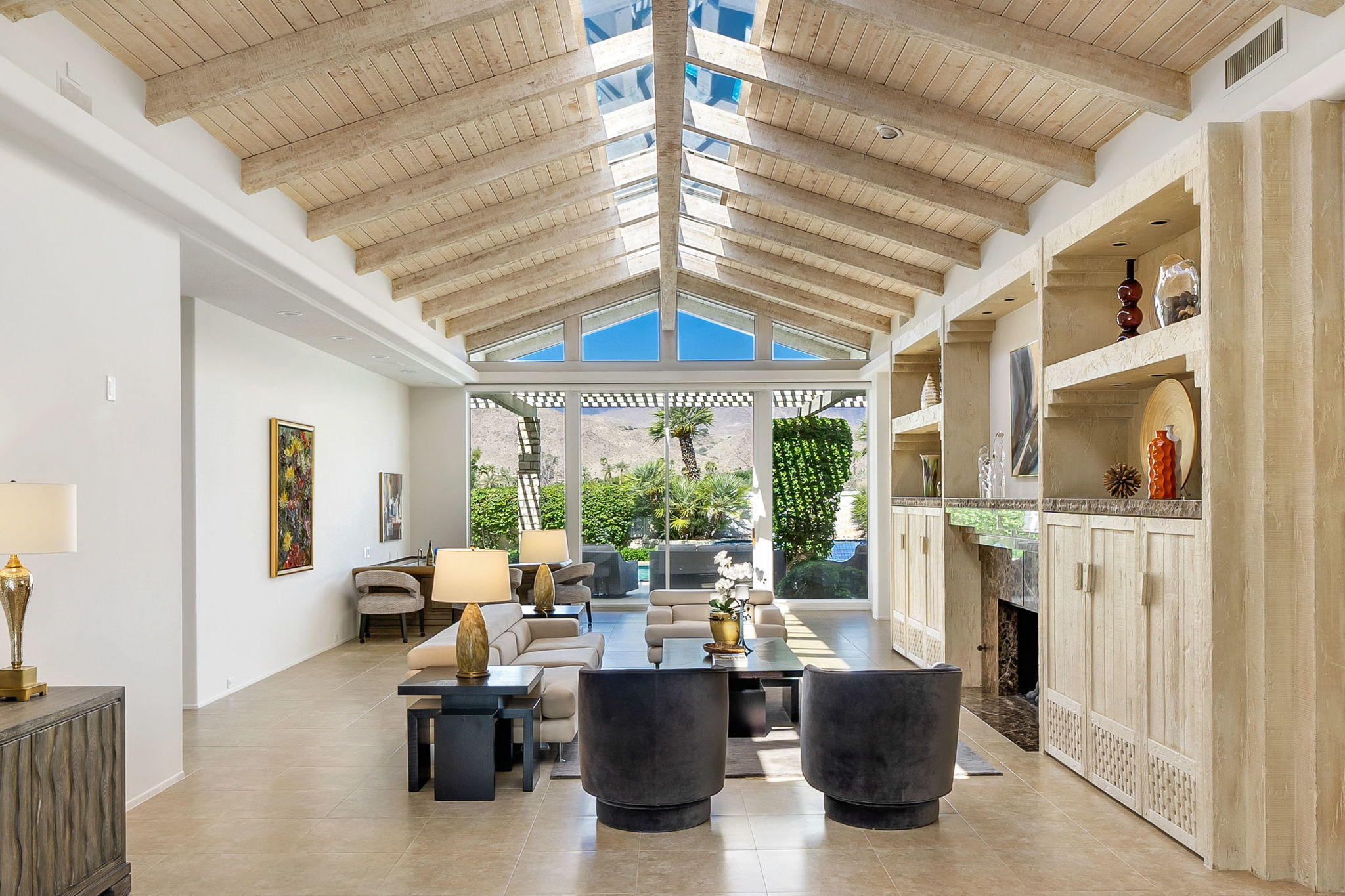 74 Mayfair Drive Rancho Mirage, CA 92270 - Photo 3 of 35 a view of a dining room with furniture large windows and wooden floor