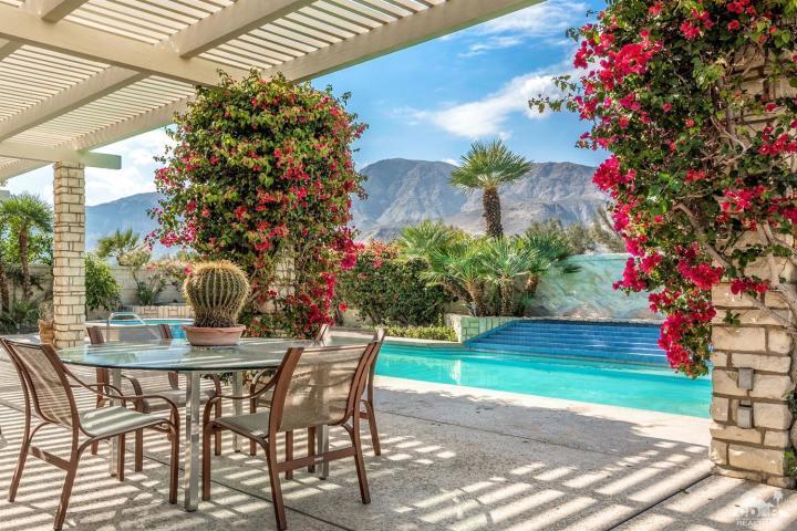 74 Mayfair Drive Rancho Mirage, CA 92270 - Photo 29 of 35 a view of a backyard with a garden and seating area