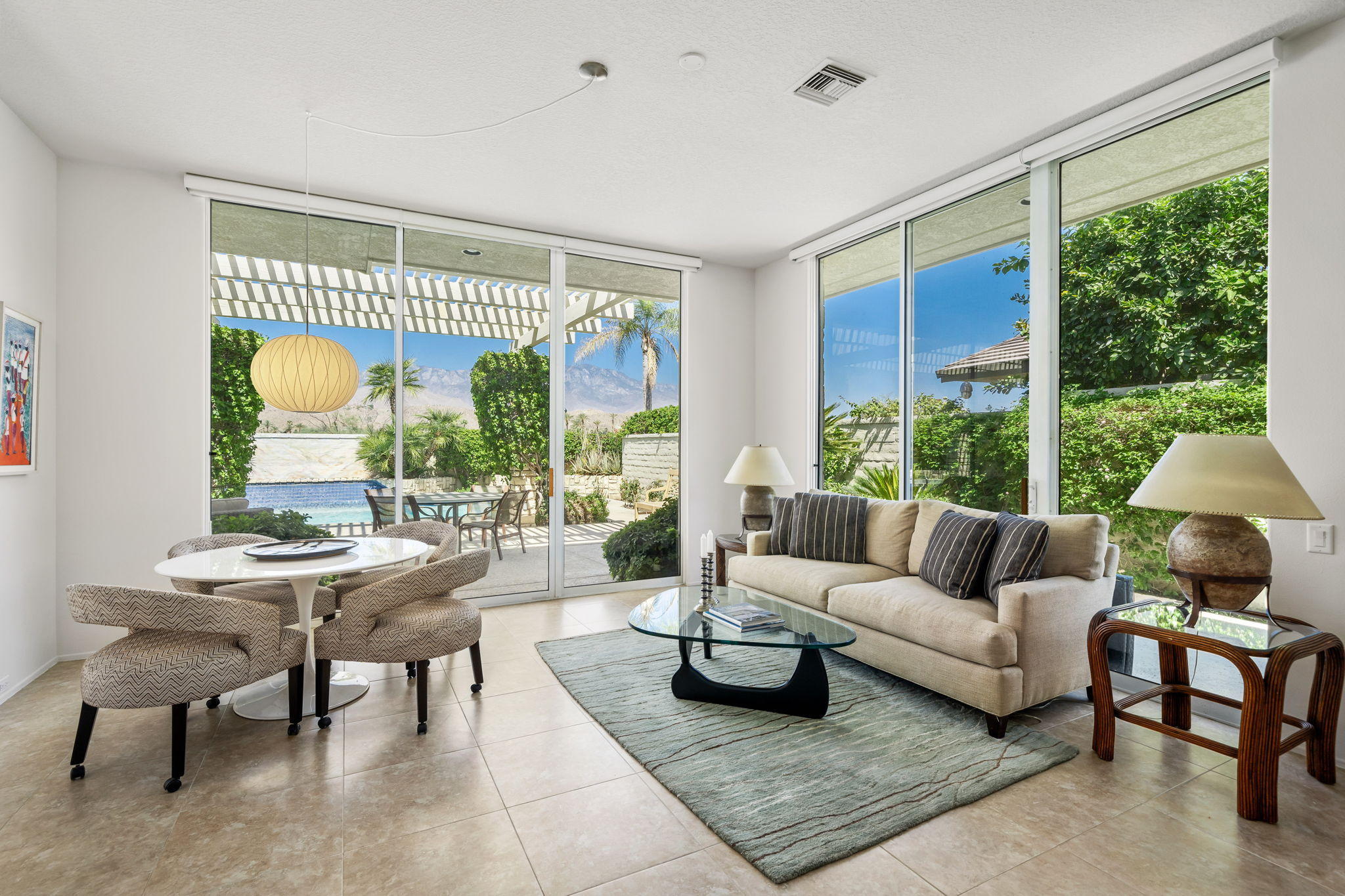 74 Mayfair Drive Rancho Mirage, CA 92270 - Photo 4 of 35 a living room with furniture and a large window