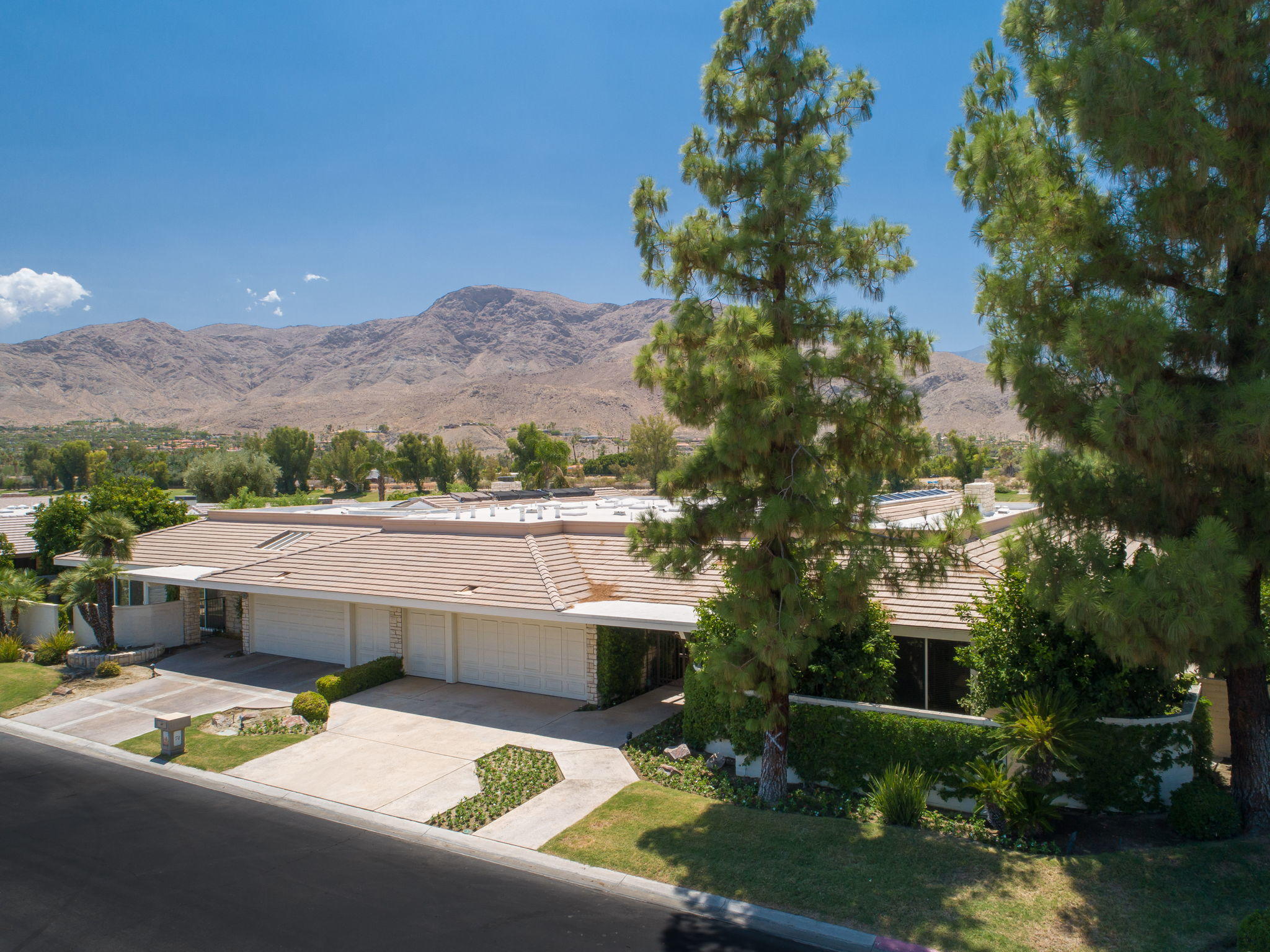 74 Mayfair Drive Rancho Mirage, CA 92270 - Photo 32 of 35 an aerial view of a house with a garden