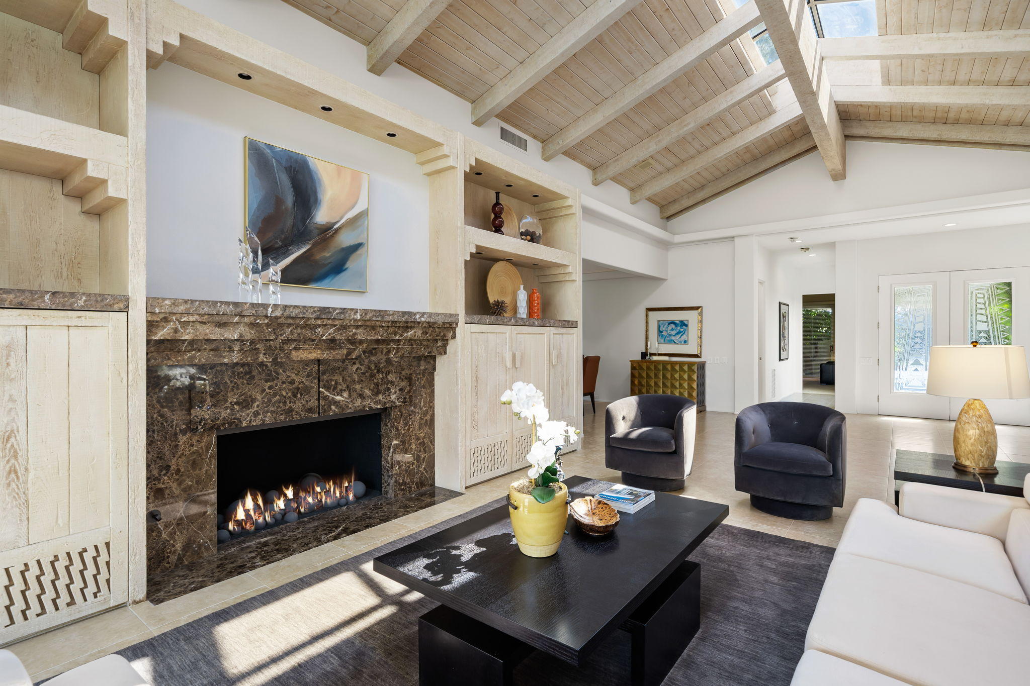 74 Mayfair Drive Rancho Mirage, CA 92270 - Photo 6 of 35 a living room with furniture and a fireplace