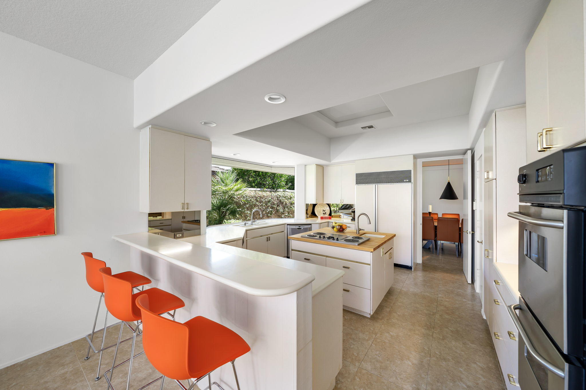 74 Mayfair Drive Rancho Mirage, CA 92270 - Photo 10 of 35 a room with stainless steel appliances furniture refrigerator and fireplace