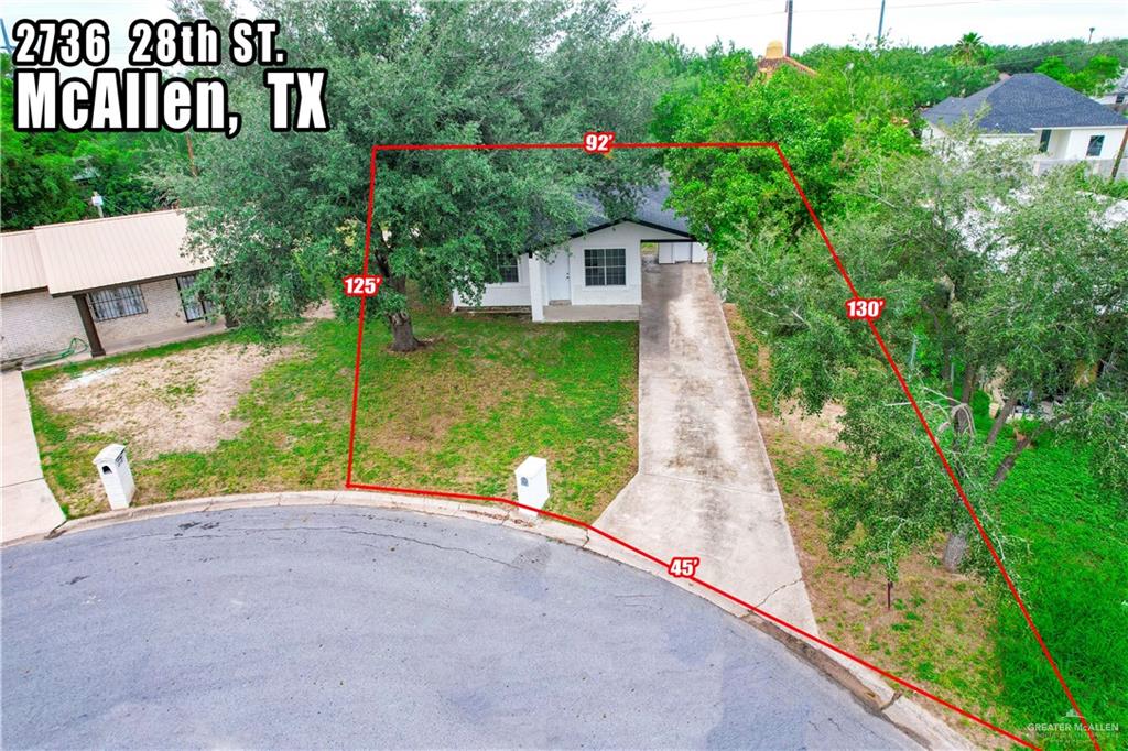 2736 South 28th Street McAllen, TX 78503 - Photo 7 of 14 a view of a house with a small yard and a large tree