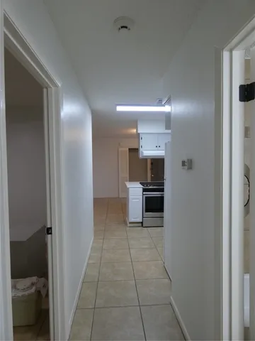 a view of a bedroom from a hallway