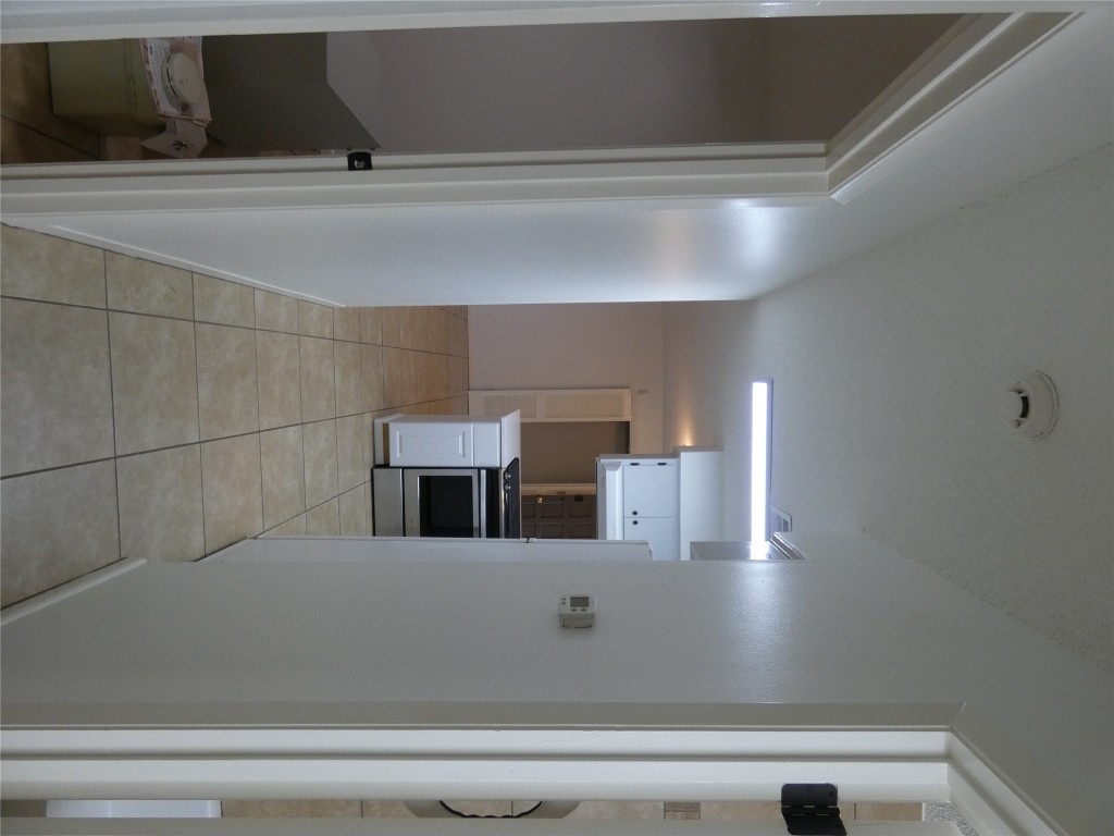 2203 Western Trails Boulevard, Unit B Austin, TX 78745 - Photo 11 of 33 a view of a bedroom from a hallway