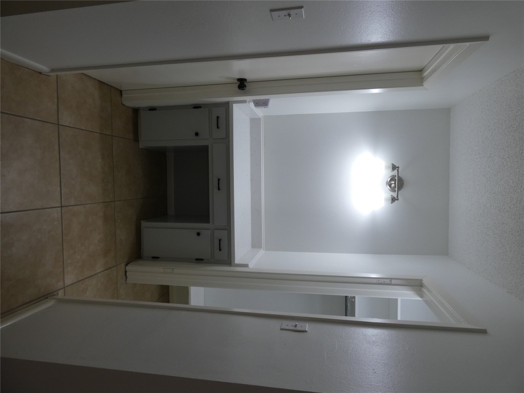 2203 Western Trails Boulevard, Unit B Austin, TX 78745 - Photo 13 of 33 a bathroom with a sink and a mirror