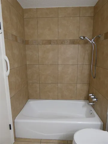 a bathroom with a shower and a toilet