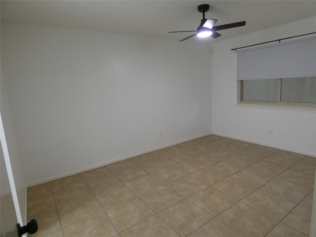 2203 Western Trails Boulevard, Unit B Austin, TX 78745 - Photo 20 of 33 a view of an empty room and chandelier fan