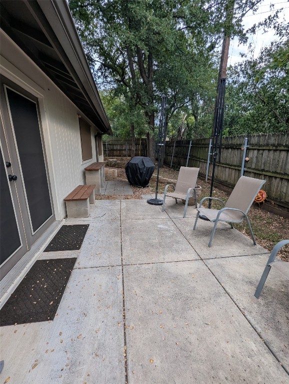 2203 Western Trails Boulevard, Unit B Austin, TX 78745 - Photo 24 of 33 a view of backyard with outdoor seating and trees