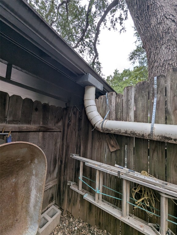 2203 Western Trails Boulevard, Unit B Austin, TX 78745 - Photo 29 of 33 a backyard of a house with a lake view