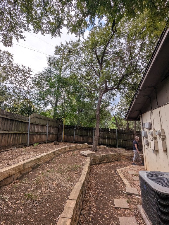 2203 Western Trails Boulevard, Unit B Austin, TX 78745 - Photo 31 of 33 a backyard of a house with lots of green space