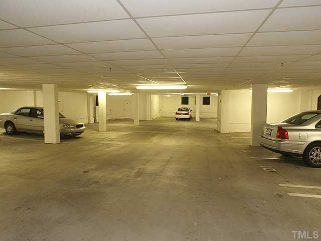 2901 Market Bridge Lane, Unit 102 Raleigh, NC 27608 - Photo 16 of 24 Parking spaces (2) #1 and storage room #1 are assigned to this condo for the Owner's exclusive use. Parking Lot/Garage