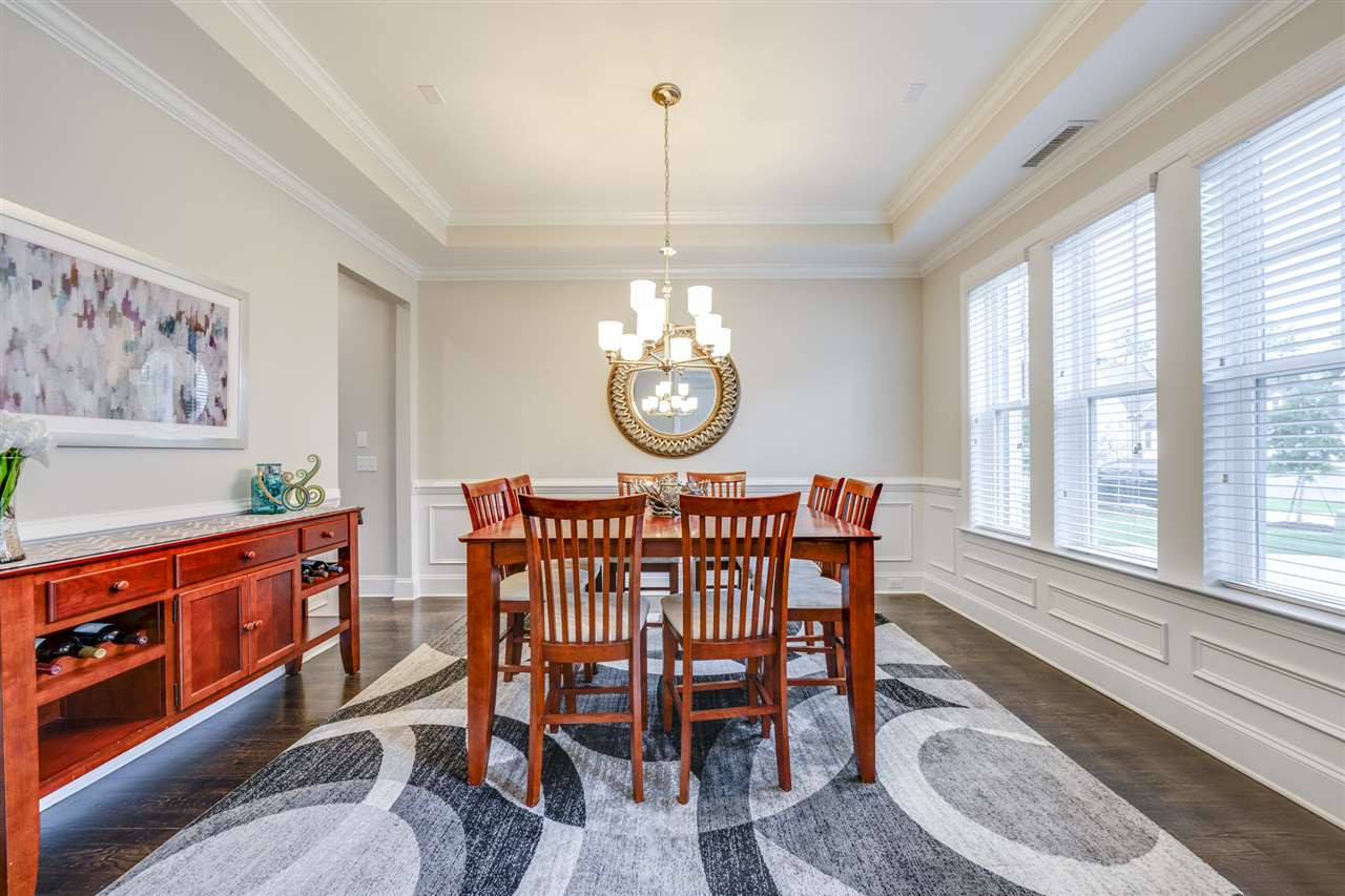 7504 Pinaster Place Raleigh, NC 27613 - Photo 2 of 30 Spacious dining room to the right of foyer boasts 10' ceilings, tray & crown moulding! Dining Room