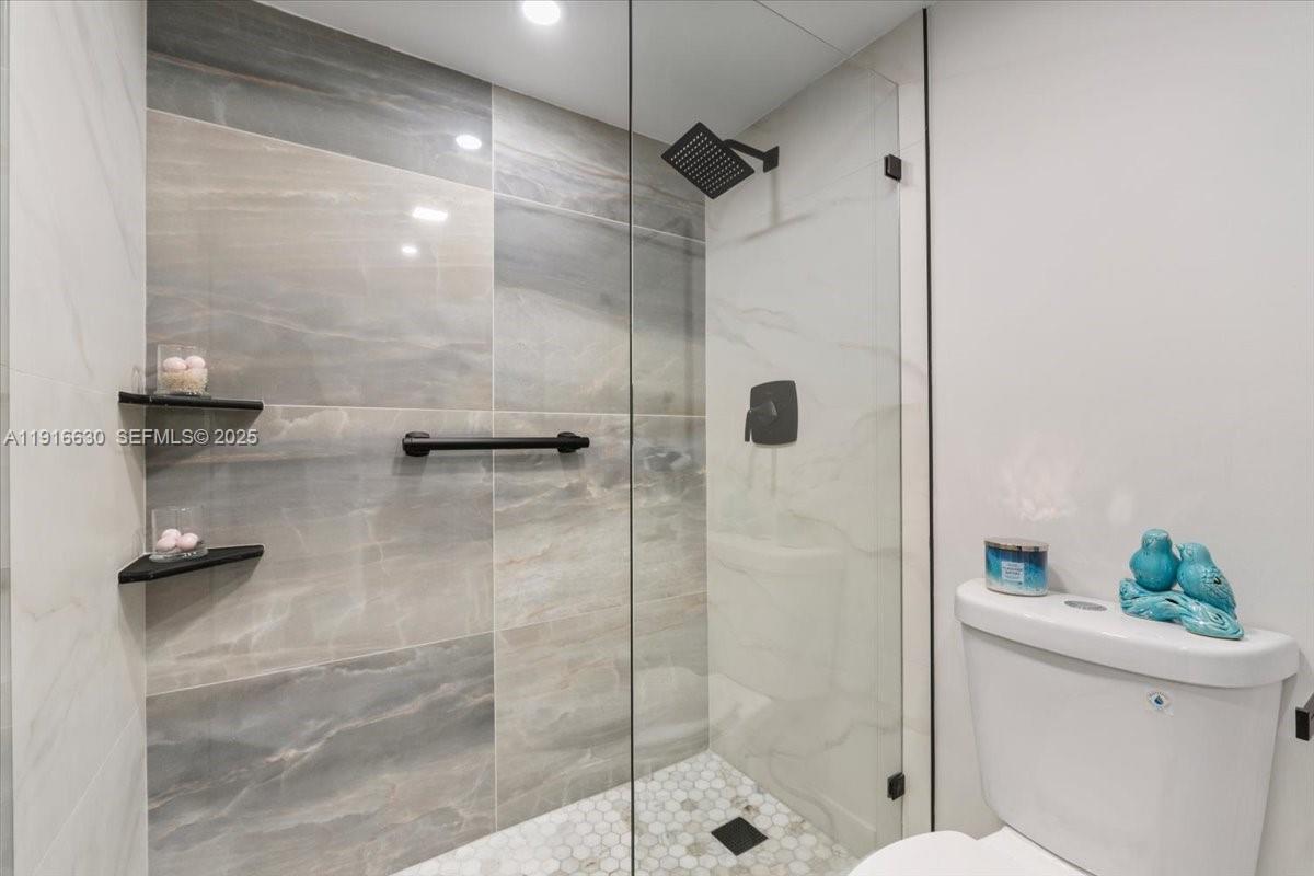 7129 Promenade Drive, Unit 801 Boca Raton, FL 33433 - Photo 14 of 42 a bathroom with a shower