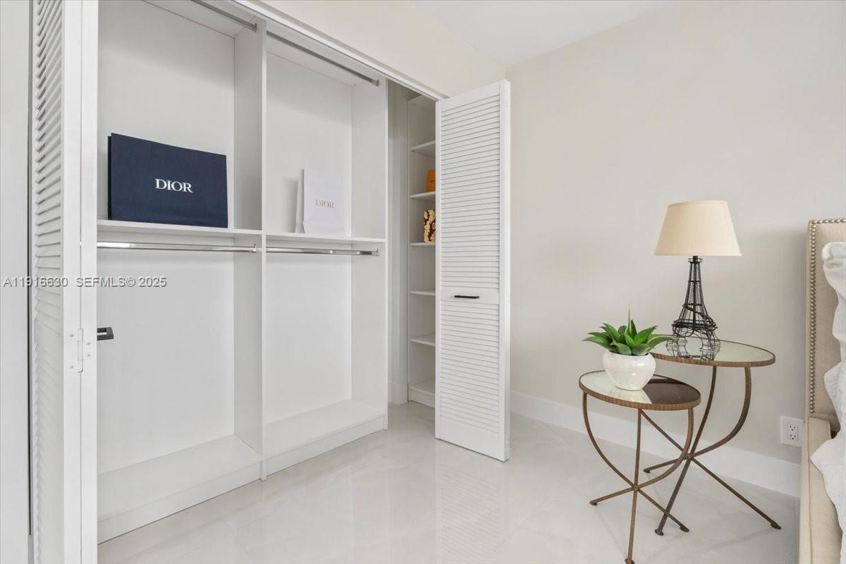 7129 Promenade Drive, Unit 801 Boca Raton, FL 33433 - Photo 16 of 42 a living room with furniture and a potted plant