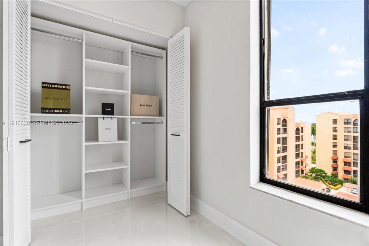 7129 Promenade Drive, Unit 801 Boca Raton, FL 33433 - Photo 26 of 42 a view of a hallway with workspace and a window