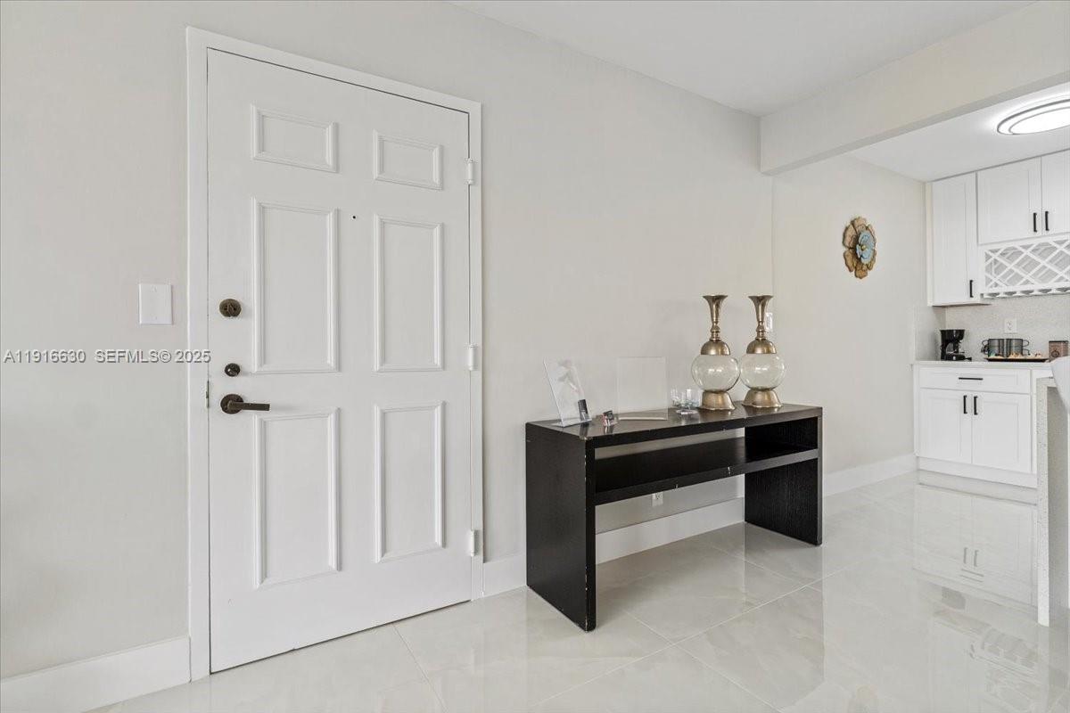 7129 Promenade Drive, Unit 801 Boca Raton, FL 33433 - Photo 6 of 42 a view of a cabinet with mirror