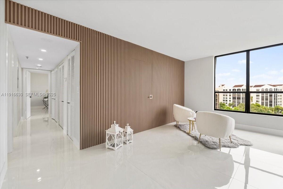 7129 Promenade Drive, Unit 801 Boca Raton, FL 33433 - Photo 9 of 42 a bedroom with a bed and a large window