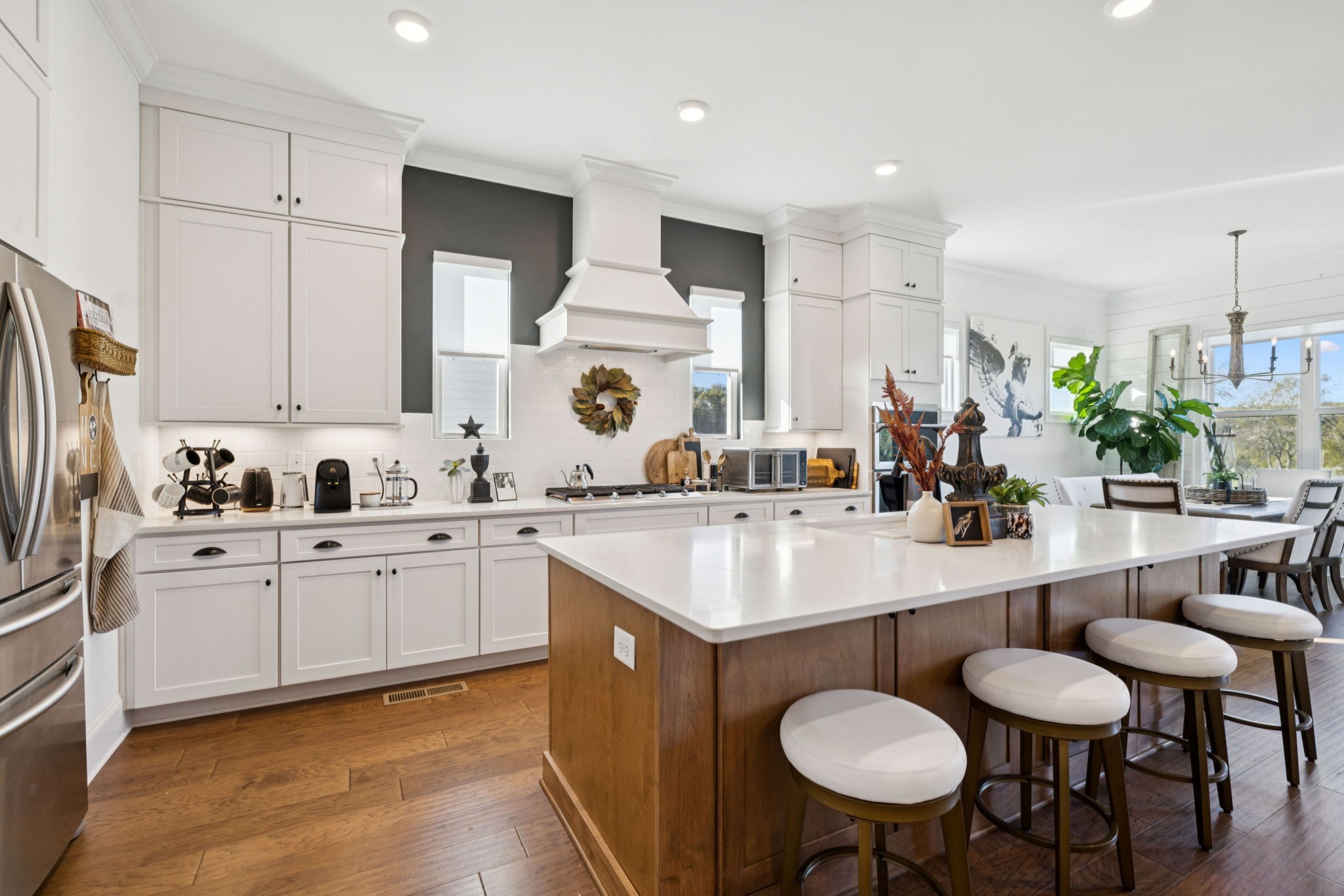 7143 Neills Branch Drive College Grove, TN 37046 - Photo 28 of 74 a kitchen with stainless steel appliances granite countertop a sink and white cabinets